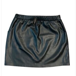Black Faux Leather Mini Skirt With Pockets. Brand new. Inside lining very soft.